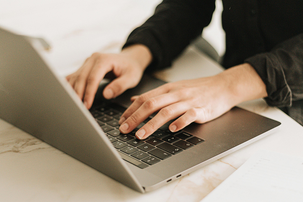 typing on laptop