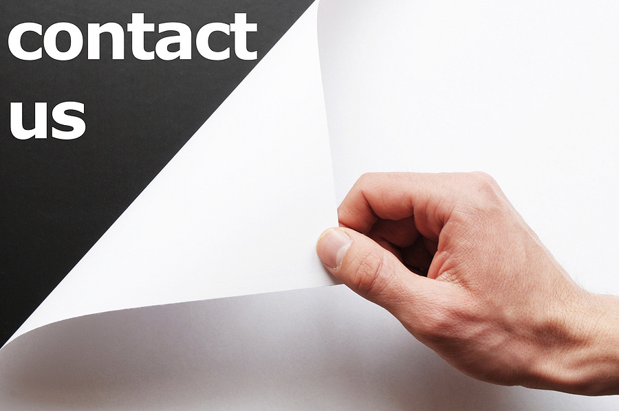 Contact Us being revealed on paper