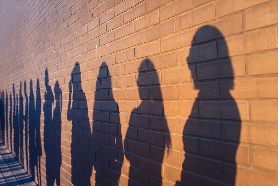 shadows of people lined up